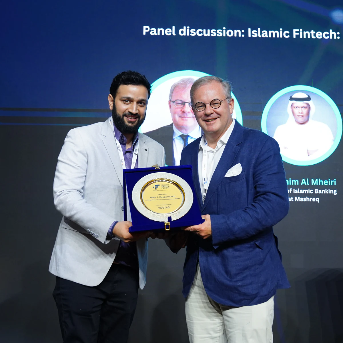 Henk Jan Hoogendoorn receiving an Islamic Fintech Forum award on stage at a previous edition